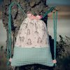 Mochila infantil pequeña de tela con estampado de unicornios hecha a mano.